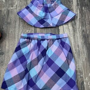 A Children’s Place Purple plaid 4T vintage skirt and hat set.